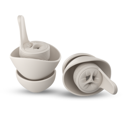 A pair of everyday earplugs in cream