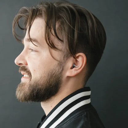side view of model wearing Sport PRO earplugs